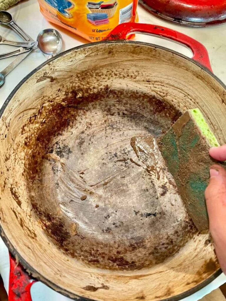 dirty dutch oven to be deep cleaned with baking soda