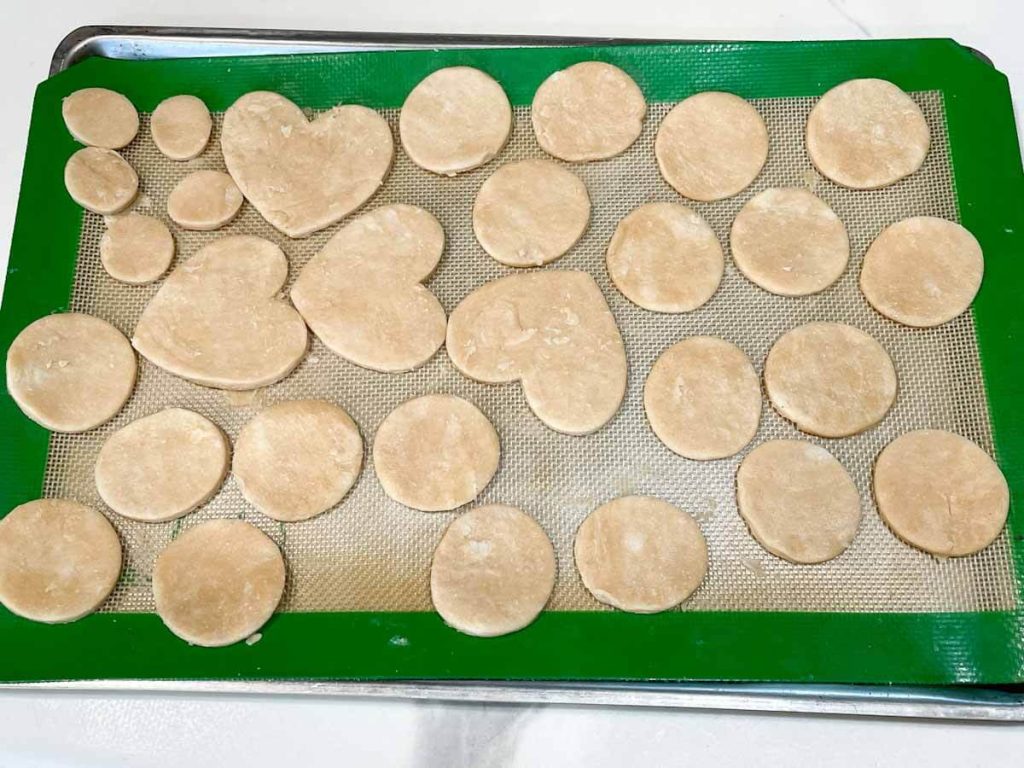 cutouts of dough in the shape of hearts and circles to make homemade dairy free egg free apple pie