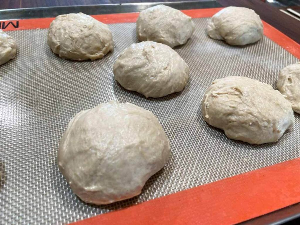 multiple unbaked biscuits on a baking sheet for easy, homemade dairy free biscuits