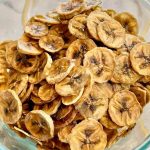 dehydrated banana chips in a glass bowl